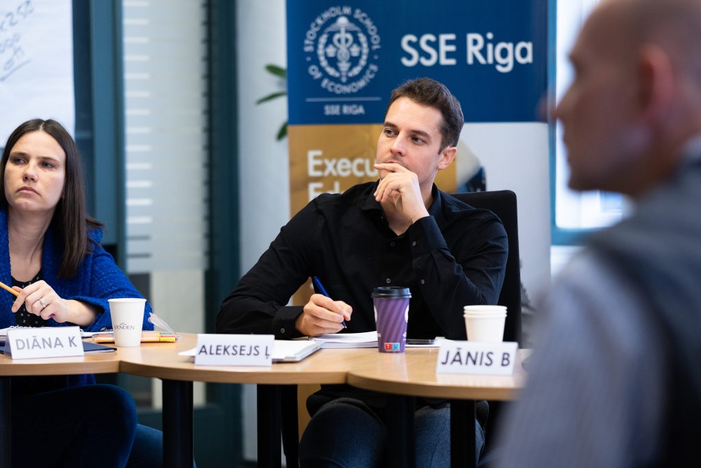 Participant of the mini MBA program sitting and listening during session.