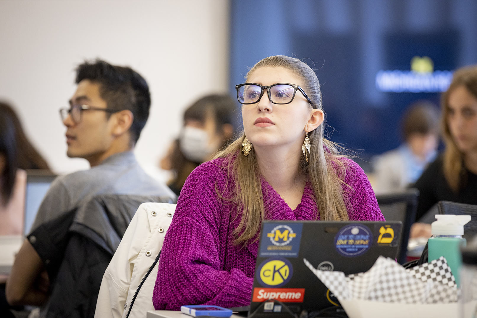 Student listening in class during a session