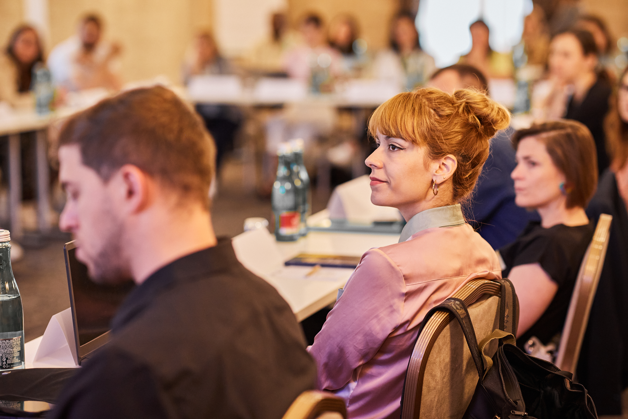 Woman listening during NGO leadershop workshop session.