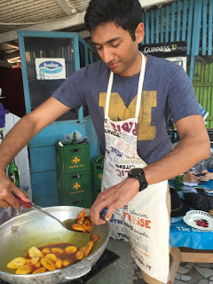 Goenka learning to cook Ghanian food.