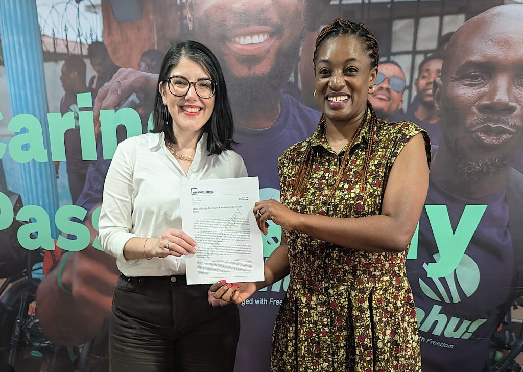 From Left: During a 2026 trip to Ghana, Diana Páez, WDI Senior Director of Energy & Mobility, and Wahu CEO Valerie Labi, proudly display the a co-developed a business teaching case study, published by WDI Publishing.