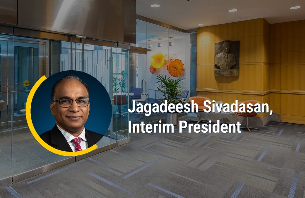 Jagadeesh Sivadasan headshot on top of background image of WDI lobby with the words Jagadeesh Sivadasan, Interim President overlaid.