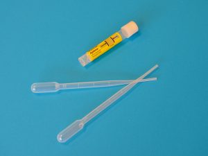 white ballpoint pen beside yellow and white plastic tool