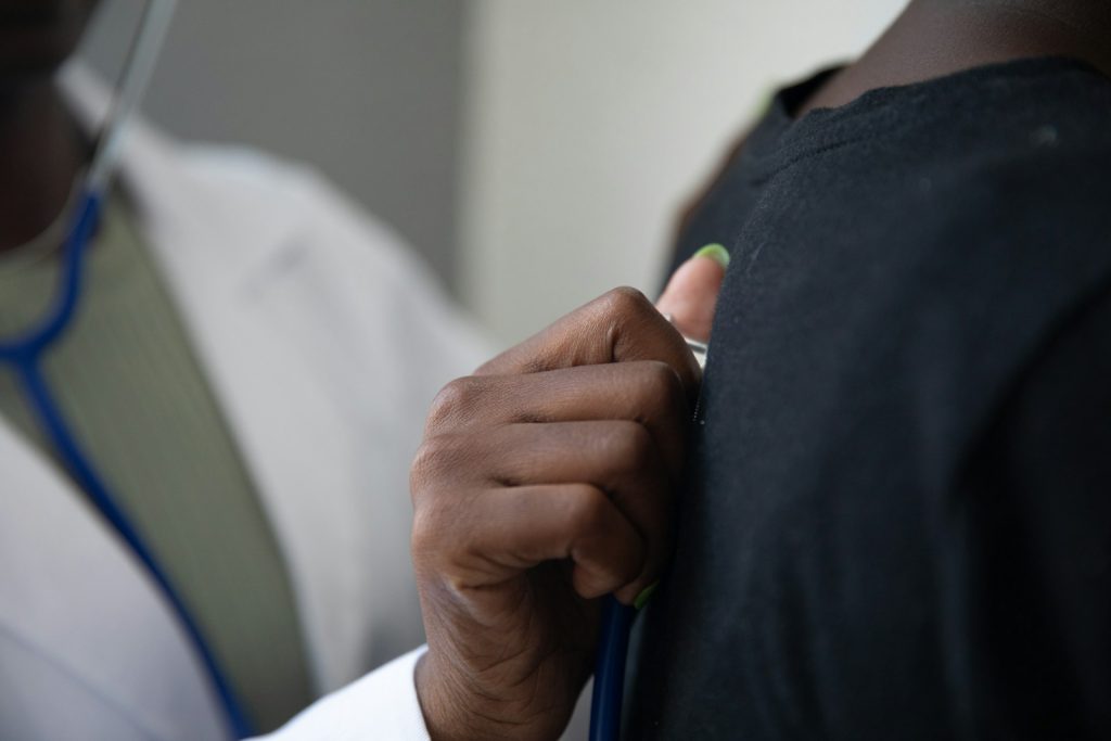a close-up of a hand holding a stethoscope
