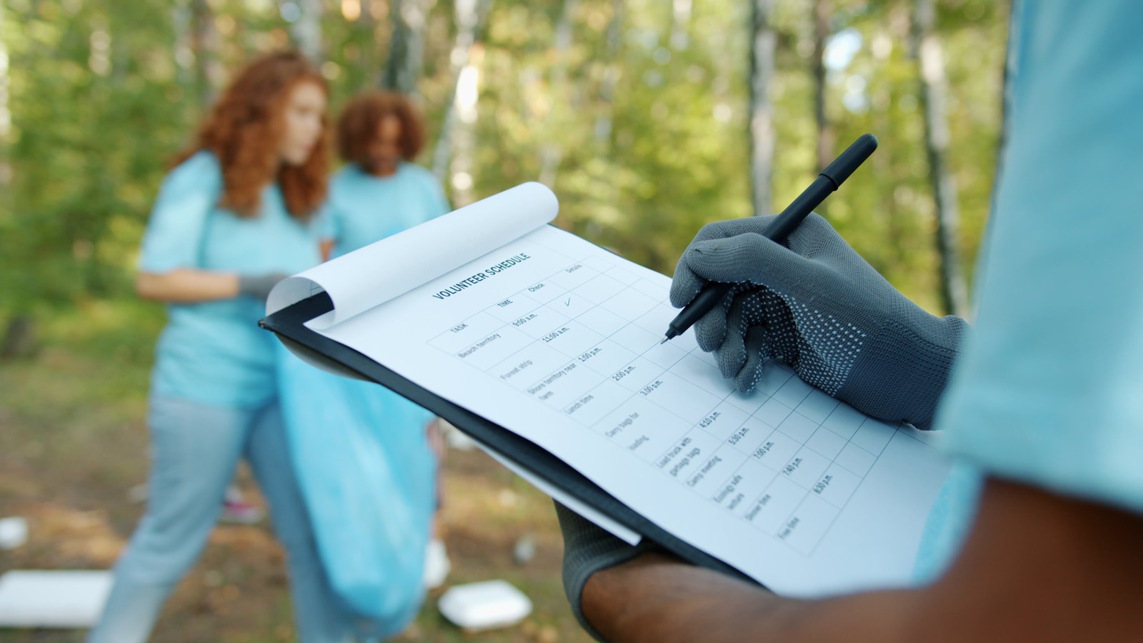 Volunteers checking a clipboard during cleanup